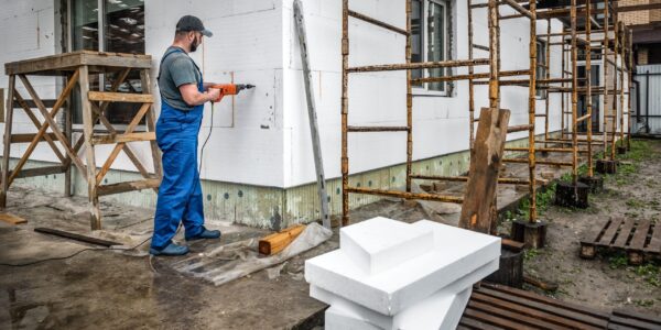 Worker,Makes,Building,Insulation,Saves,Energy,With,Styrofoam.,Industrial,Theme